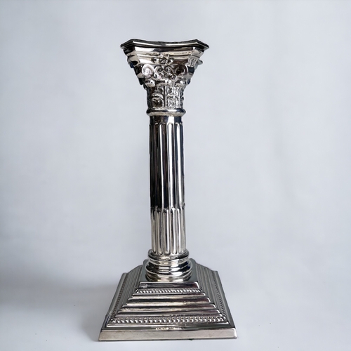 96 - A STERLING SILVER CORINTHIAN CAPITOL COLUMN CANDLESTICK.
Birmingham, 1965 hallmarks. 
Height - 19.5c... 