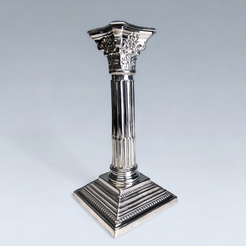 96 - A STERLING SILVER CORINTHIAN CAPITOL COLUMN CANDLESTICK.
Birmingham, 1965 hallmarks. 
Height - 19.5c... 