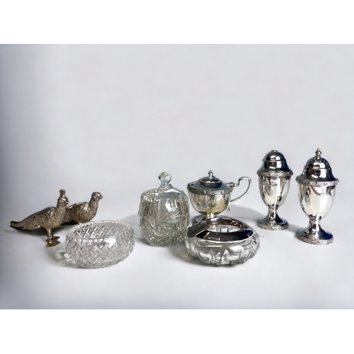 98 - A STERLING SILVER & CUT GLASS ASHTRAY.
Together with a collection of silver plate condiments, Pheasa... 