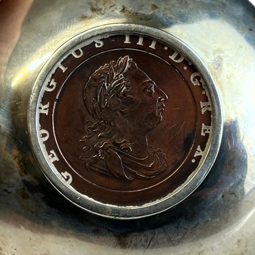 109 - TWO STERLING SILVER COIN INSET DISHES.
One with a George III cartwheel penny and another with a Old ... 