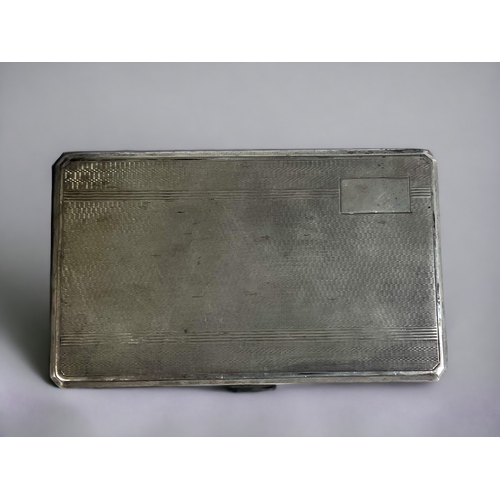 110 - A STERLING SILVER CIGARETTE CASE. 
Engine turned design, with Gilt interior. 
Birmingham, 1946 hallm... 