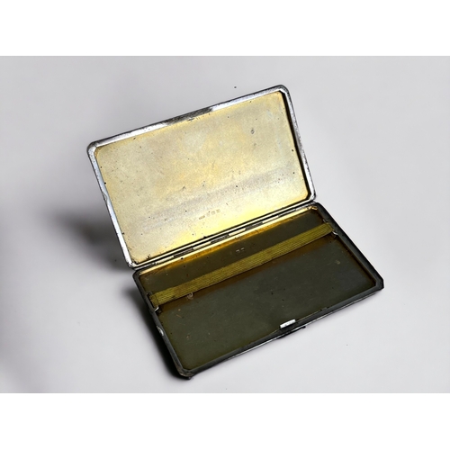 110 - A STERLING SILVER CIGARETTE CASE. 
Engine turned design, with Gilt interior. 
Birmingham, 1946 hallm... 