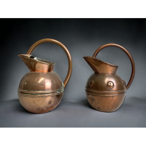 223 - TWO 19TH CENTURY CHRISTOPHER DRESSER ATTRIBUTED COPPER WATER JUGS. BY HENRY LOVERIDGE.  CIRCA 1885. ... 