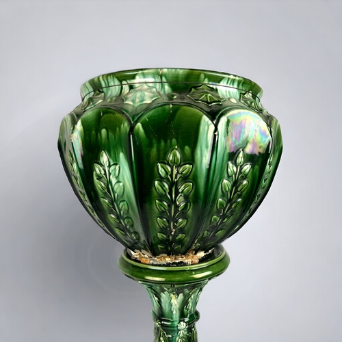 157 - A LARGE WILLIAM AULT JARDINIERE & STAND.
Green glazed majolica.