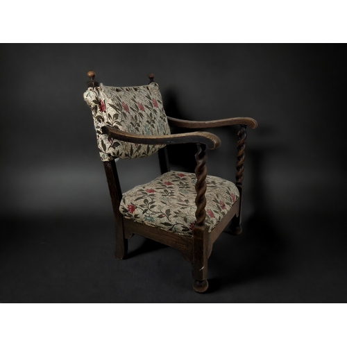 1 - A VICTORIAN UPHOLSTERED OAK SLIPPER CHAIR.
With carved Barley twist arms and foliate design upholste... 