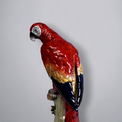 312 - A SITZENDORF PORCELAIN PARROT FIGURINE.
'Scarlet Macaw'
Sitzendorf, Thuringia, C1920.
Height - 23.5c... 