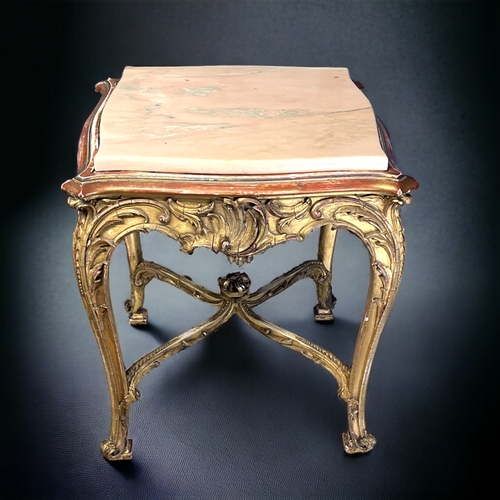 205 - A LOUIS XIV STYLE GILTWOOD COFFEE TABLE.
19th century, French.
Intricately carved Giltwood foliate d... 