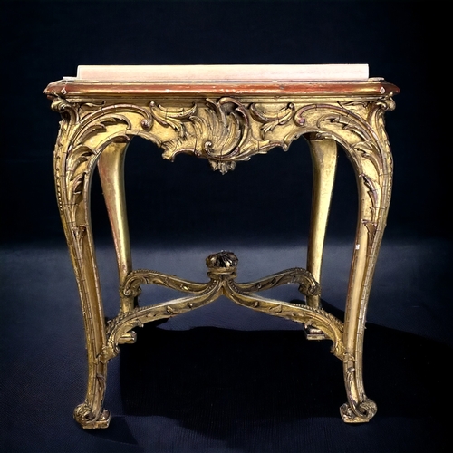 205 - A LOUIS XIV STYLE GILTWOOD COFFEE TABLE.
19th century, French.
Intricately carved Giltwood foliate d... 