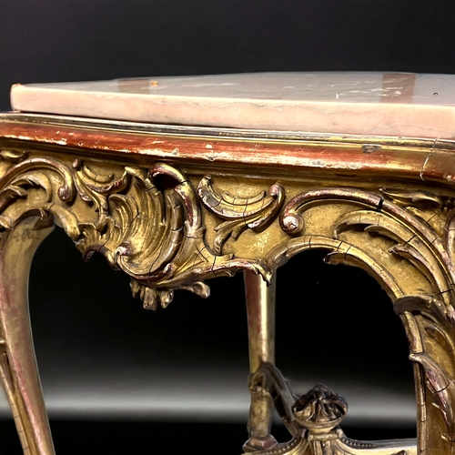 205 - A LOUIS XIV STYLE GILTWOOD COFFEE TABLE.
19th century, French.
Intricately carved Giltwood foliate d... 