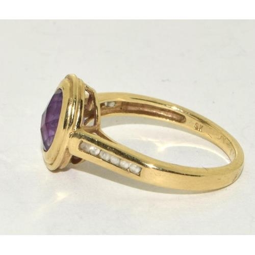 427 - 9ct Gold Ladies Amethyst Halo Design Ring. Size Q 3g