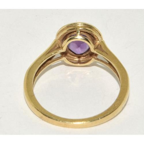 427 - 9ct Gold Ladies Amethyst Halo Design Ring. Size Q 3g