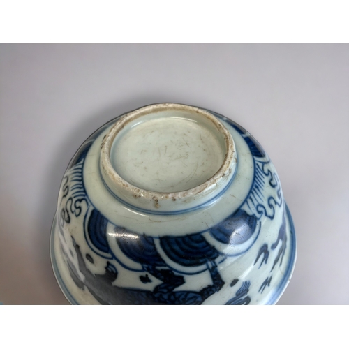 10 - A CHINESE BLUE & WHITE PORCELAIN BOWL. Painted in the Kangxi style, depicting mythical Horse, El... 