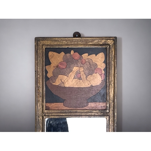 206 - A ROWLEY GALLERY MARQUETRY WALL MIRROR.
Inlaid scene depicting a baby in a bowl of fruits.