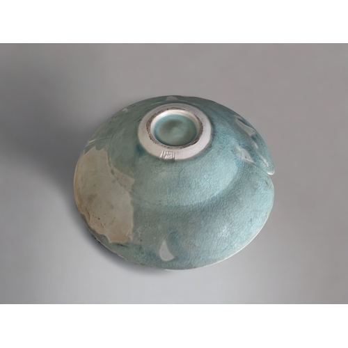 20 - A STUDIO POTTERY 'LOTUS' SHAPE BOWL.
With a longquan type celadon glaze. 
Impressed mark to base. 
6... 