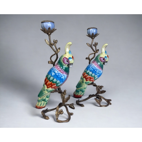 337 - A PAIR OF LARGE HANDPAINTED CERAMIC PARROTS CANDLESTICKS.
Gilt metal mounted in a Acorn & leaf desig... 