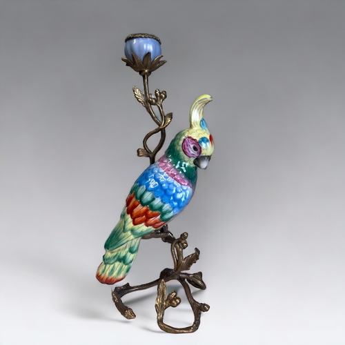 337 - A PAIR OF LARGE HANDPAINTED CERAMIC PARROTS CANDLESTICKS.
Gilt metal mounted in a Acorn & leaf desig... 