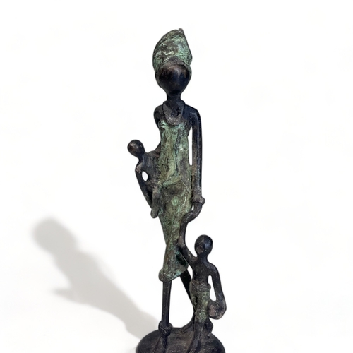 339 - An African bronze figure.
20th Century
Depicting a mother with two kids. 
Height - 16.5cm