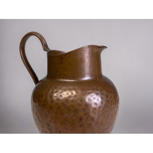 345 - A Pair of Arts & Crafts Style Copper Milk Jugs. 
Marked to base.