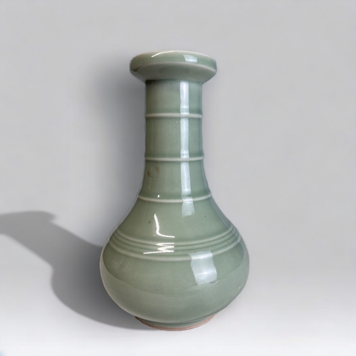 357 - A Chinese Celadon Glaze Vase. 
Mallet form.
Height - 21cm