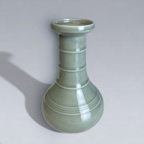 357 - A Chinese Celadon Glaze Vase. 
Mallet form.
Height - 21cm