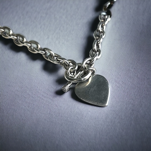 362 - A Sterling Silver 'Heart' Fob Necklace. Together with a similar Bracelet.
Gross weight - 63g