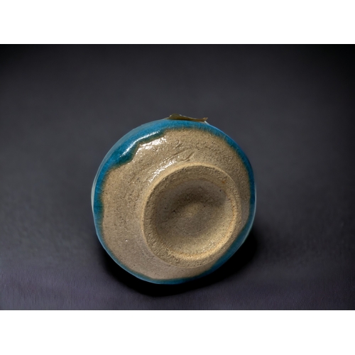 159 - A JAPANESE POTTERY SUITEKI WATER DROPPER.
Late Meiji period. 
Turquoise glazed. 
6.5 x 7.5cm