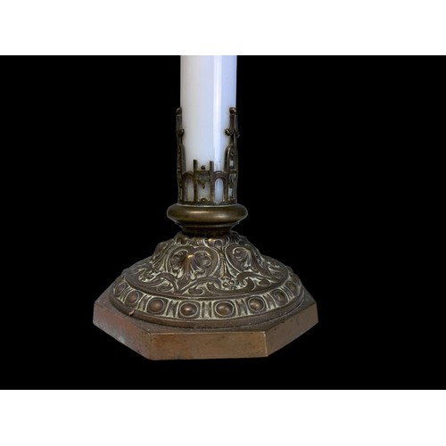 284 - AN UNUSUAL BRASS & GLASS ALTAR CANDLESTICK.
French, Circa 1900.
With a white iridescent glass column... 