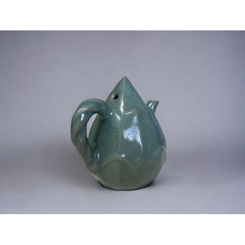 4 - A KOREAN CELADON 'LOTUS' WATER DROPPER.
Teapot shaped, modelled as a Lotus. Celadon glazed. 
Signed ... 