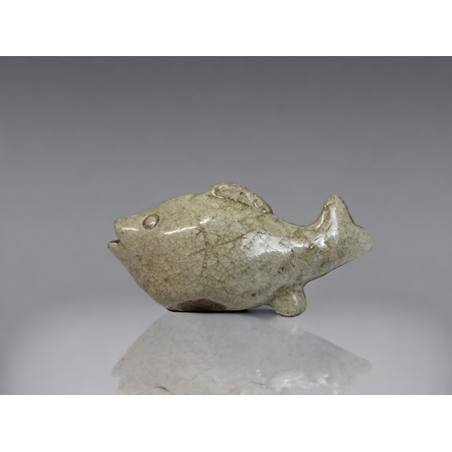 31 - A CHINESE QINGBAI WARE WATER DROPPER.
Song dynasty. 
Modelled as a carp.
9 x 4cm