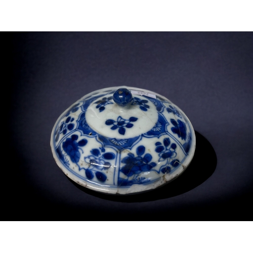 32 - A CHINESE BLUE & WHITE PORCELAIN TWIN HANDLE CUP.
Kangxi period (1661-1722).
On raised foot, with pa... 