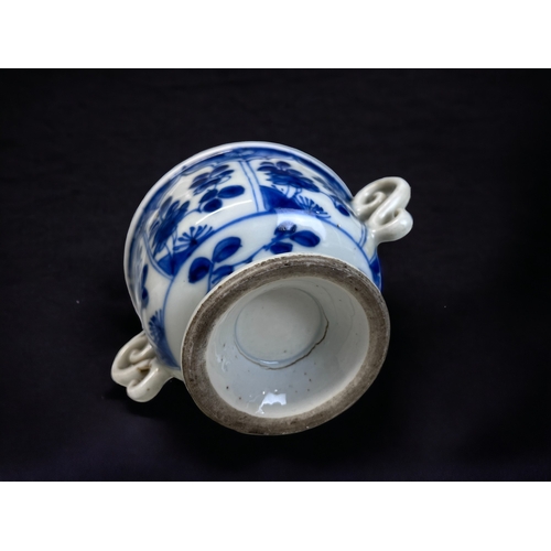 32 - A CHINESE BLUE & WHITE PORCELAIN TWIN HANDLE CUP.
Kangxi period (1661-1722).
On raised foot, with pa... 