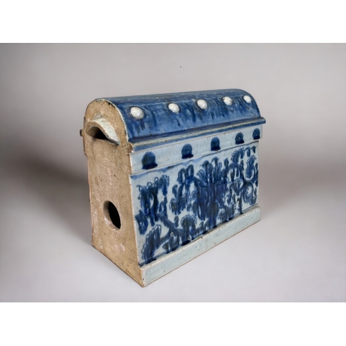 33 - A SCARCE CHINESE PORCELAIN BUILDING BLOCK RIDGE TILE. 
Qing dynasty. 
Blue & white painted foliate d... 