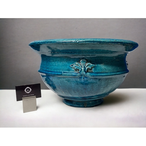 344 - A LARGE ART NEAUVEAU PLANTER.
Circa 1900.
Stoneware, with a turquoise Majolica glaze and fleur-de-li... 