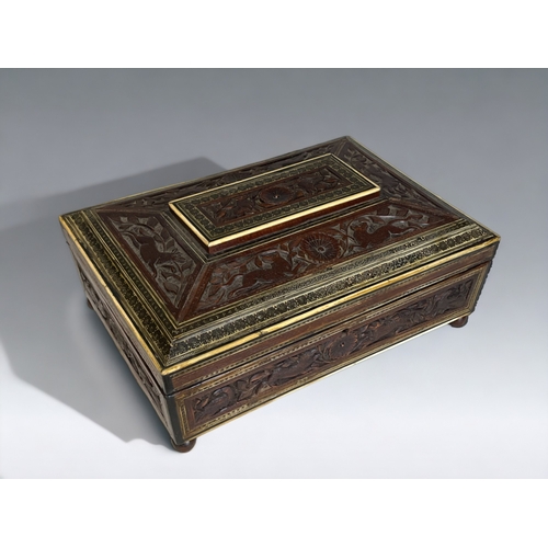 181 - A LARGE ANGLO INDIAN CARVED SANDALWOOD & SADELI BOX.
19th century.
Bone & ebony inlay, with carved a... 