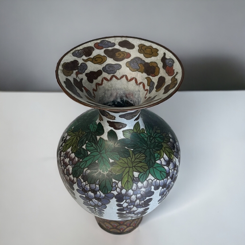 43 - A LARGE JAPANESE ENAMEL CLOISONNE VASE.
Meiji period. 
Beautifully decorated with large bunches of l... 