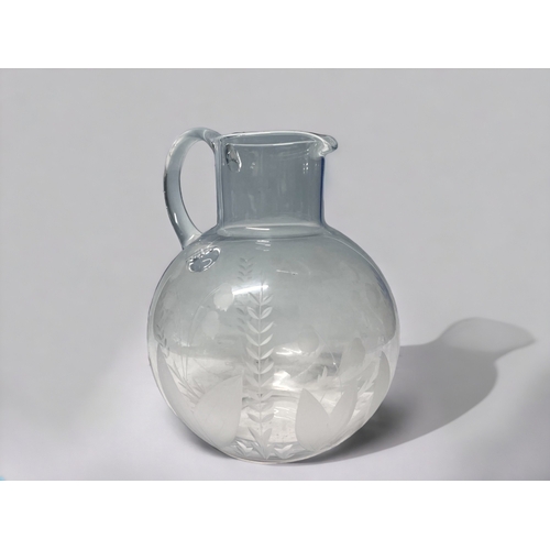 351 - A TIFFANY & CO CRYSTAL WATER PITCHER.
Etched 'Lily of the valley' pattern.
Marked to base.
Height - ... 