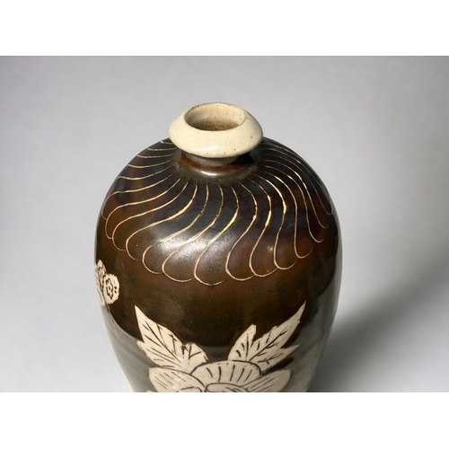 75 - A large Chinese Cizhou ware vase. Meiping form. Brown glaze with 'slip' figure, with large Peony &am... 