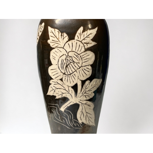 75 - A large Chinese Cizhou ware vase. Meiping form. Brown glaze with 'slip' figure, with large Peony &am... 