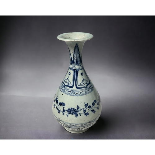 79 - A Chinese blue & white porcelain vase. Pear shaped (Yuhuchunping). Central stylised meandering L... 