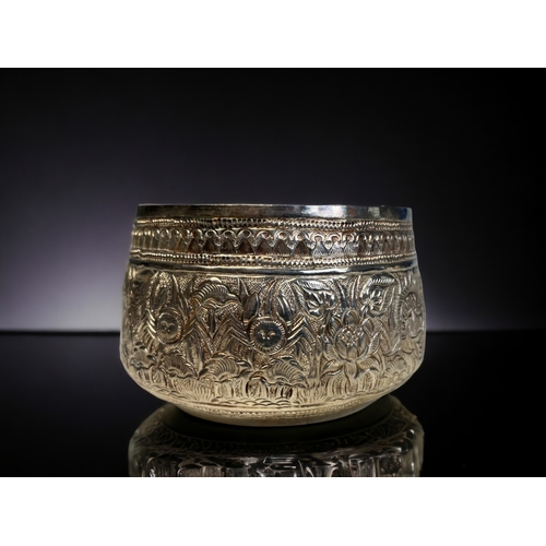 6 - A PAIR OF BURMESE SILVER THABEIK BOWL. Repousse decorated with fish and crabs amongst stylised folia... 