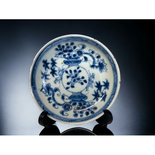 80 - TWO CHINESE BLUE & WHITE PORCELAIN TEABOWLS & SAUCERS.
Kangxi period.
Painted vases of flowers.