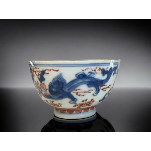 84 - A CHINESE PORCELAIN 'AMSTERDAM BONT' BOWL.
Kangxi period.
Blue painted Qilong Dragons, with later Du... 