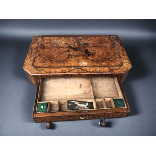 230 - A VICTORIAN BURR WALNUT WORK TABLE.
Carved legs raised on original casters. Joined by turned wood st... 