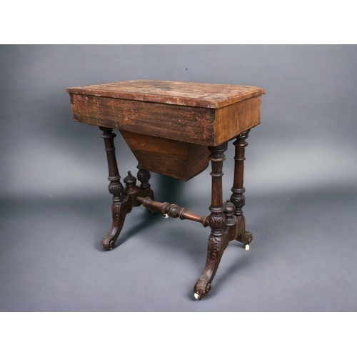 230 - A VICTORIAN BURR WALNUT WORK TABLE.
Carved legs raised on original casters. Joined by turned wood st... 