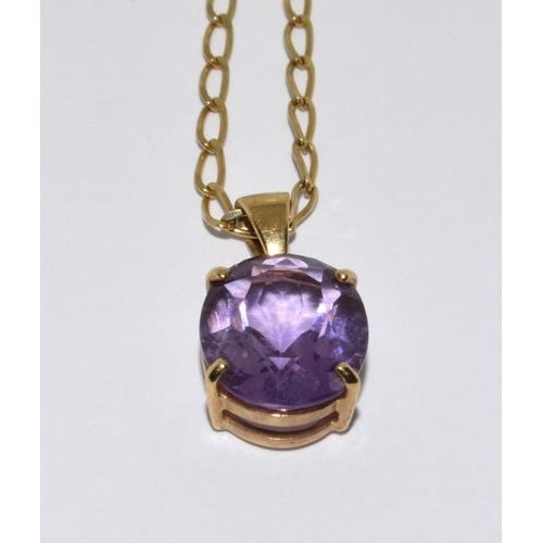 427 - 9ct gold pendant necklace set with large Amethyst stone chain 48cm