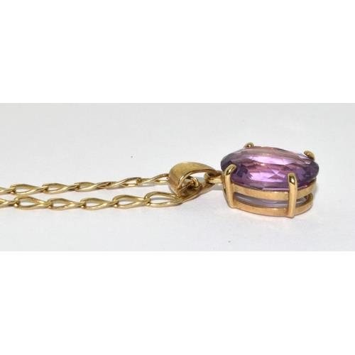 427 - 9ct gold pendant necklace set with large Amethyst stone chain 48cm