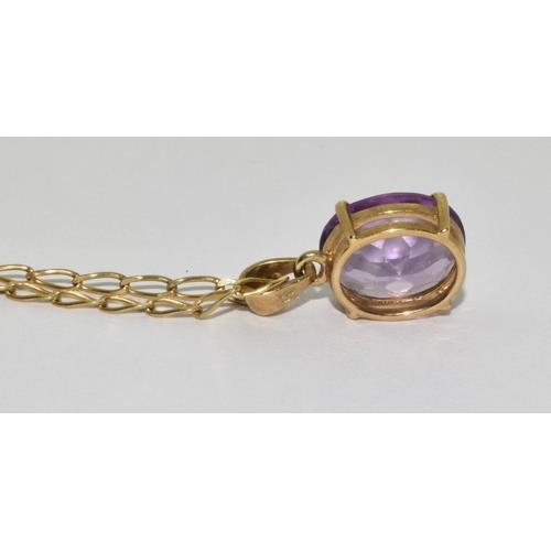 427 - 9ct gold pendant necklace set with large Amethyst stone chain 48cm