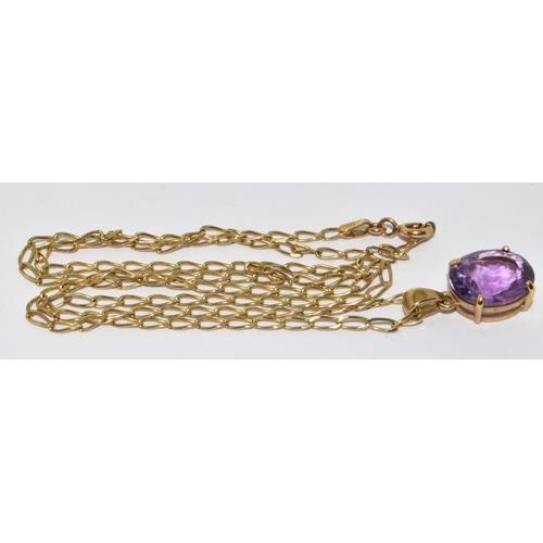 427 - 9ct gold pendant necklace set with large Amethyst stone chain 48cm