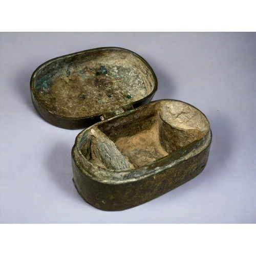 88 - A BRONZE BETEL NUT BOX.
South Asian, 18th century. 
With nut, leaf & lime compartments. Hinged lid. ... 