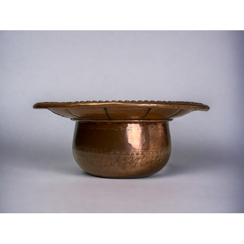 182 - A PERSIAN TINNED COPPER WASH BASIN.
18th / 19th century.
Known in Urdu as a Salfachi, with hinged li... 